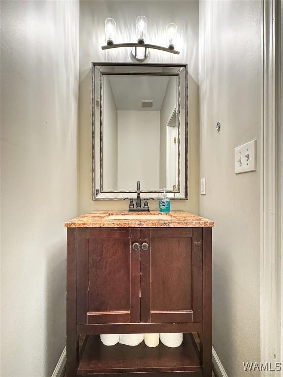 1851 Russet Woods Ln, Hoover, AL 35244 - bathroom featuring baseboards and vanity