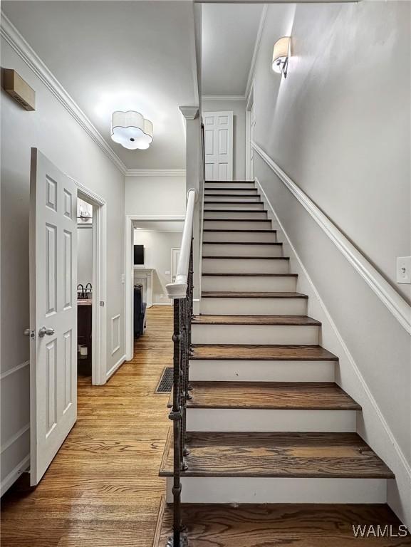 1851 Russet Woods Ln, Hoover, AL 35244 - stairs featuring crown molding and wood finished floors