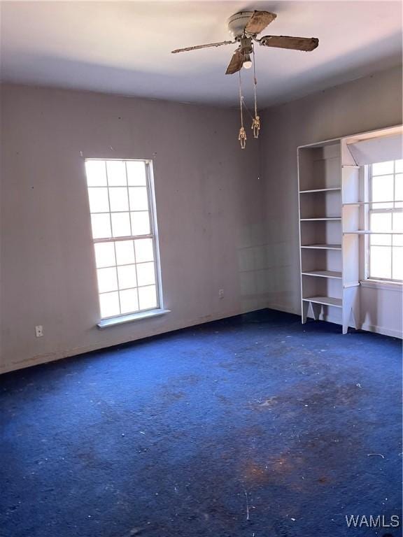 empty room featuring ceiling fan