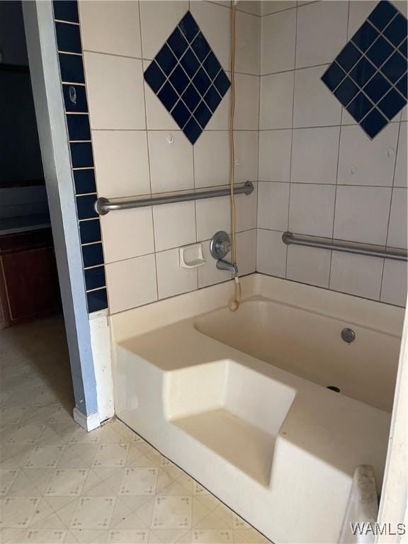 full bath with tile patterned floors and shower / bath combination