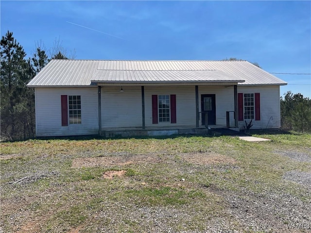 view of front of house featuring covered porch and metal roof