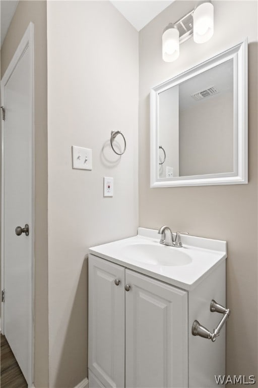 bathroom with vanity and wood-type flooring