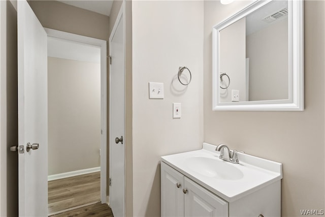 bathroom featuring wood-type flooring and vanity