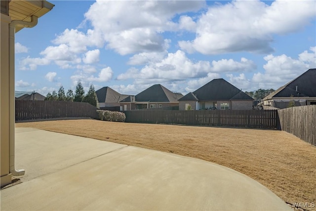 view of yard with a fenced backyard and a patio