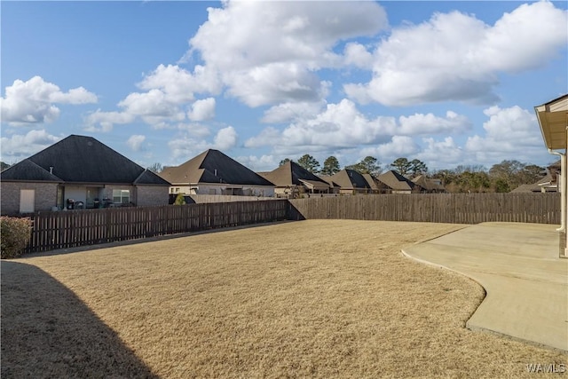 view of yard featuring a patio area and fence