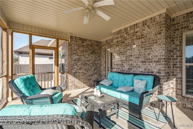 sunroom / solarium with a ceiling fan