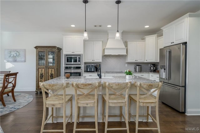 kitchen with stainless steel appliances, visible vents, custom exhaust hood, tasteful backsplash, and dark wood finished floors