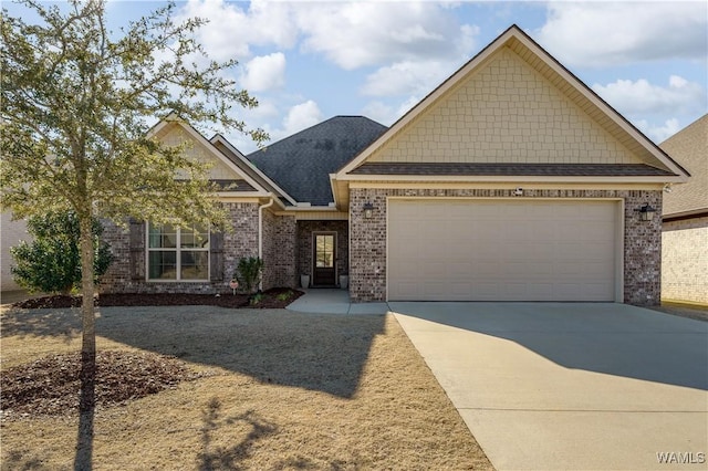 craftsman-style house featuring a garage, brick siding, driveway, and a shingled roof