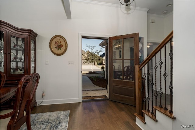 entrance foyer with baseboards, stairway, dark wood-style flooring, and ornamental molding