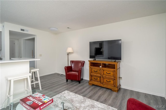 1009 12th St Unit 3, Tuscaloosa, AL 35401 - living room with wood finished floors and a textured ceiling
