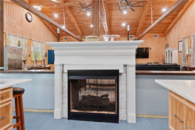 details with ceiling fan, beam ceiling, and wooden ceiling