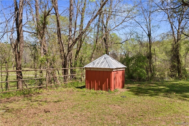 view of outdoor structure featuring a lawn