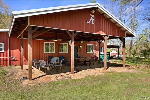 rear view of house featuring ceiling fan