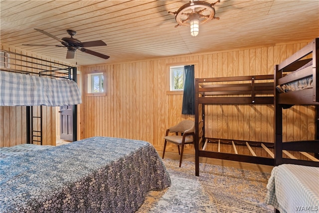 bedroom featuring ceiling fan, wooden ceiling, and multiple windows