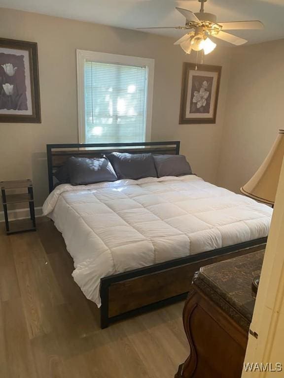 2109 20th Ave, Northport, AL 35476 - bedroom featuring hardwood / wood-style flooring and ceiling fan