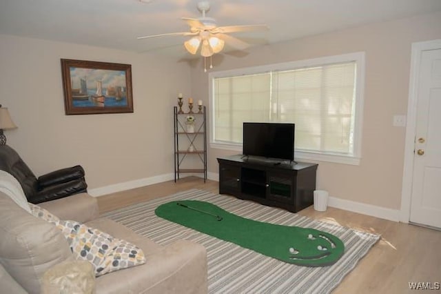 living room featuring hardwood / wood-style flooring and ceiling fan