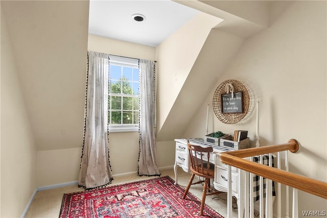 office space featuring carpet and lofted ceiling