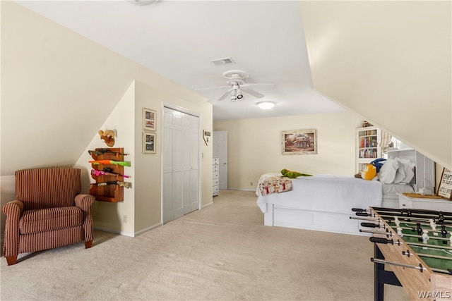 bedroom with light carpet, a closet, and ceiling fan