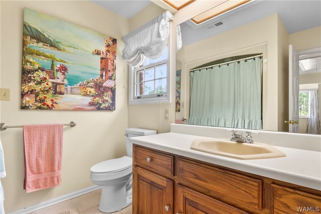 bathroom with tile patterned floors, vanity, and toilet