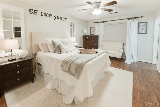 bedroom with ceiling fan and wood-type flooring