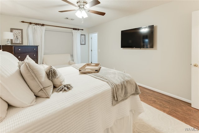 bedroom with ceiling fan and light wood-type flooring