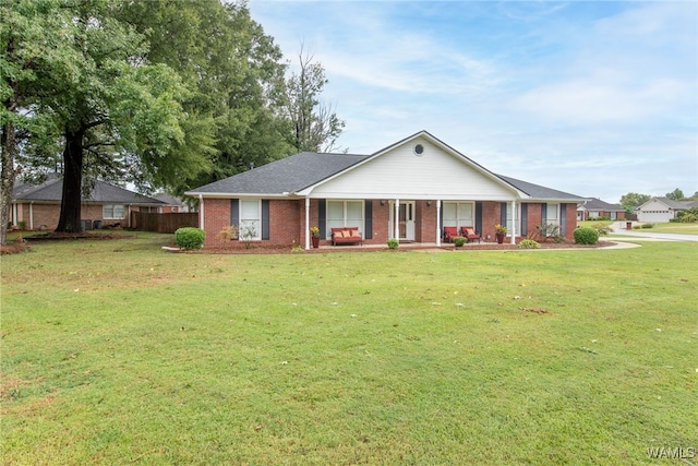 ranch-style house featuring a front yard and a porch