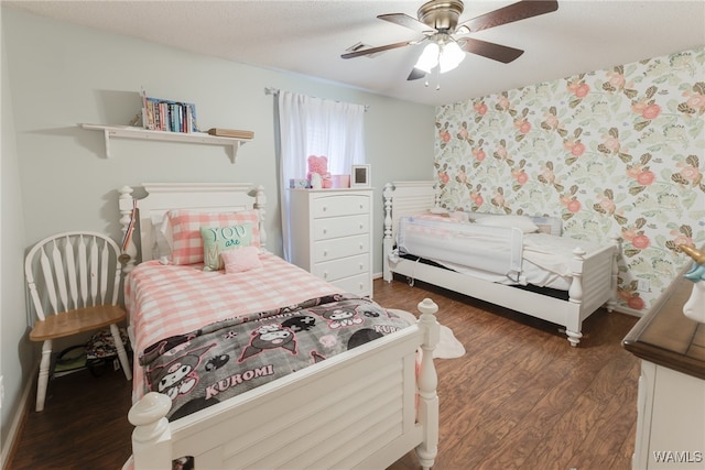 bedroom featuring ceiling fan and dark hardwood / wood-style flooring