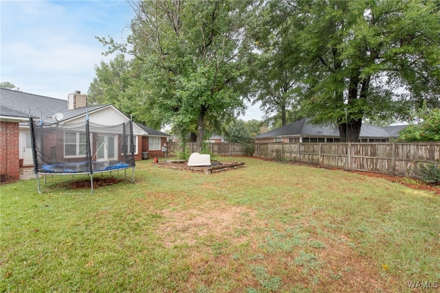 view of yard featuring a trampoline