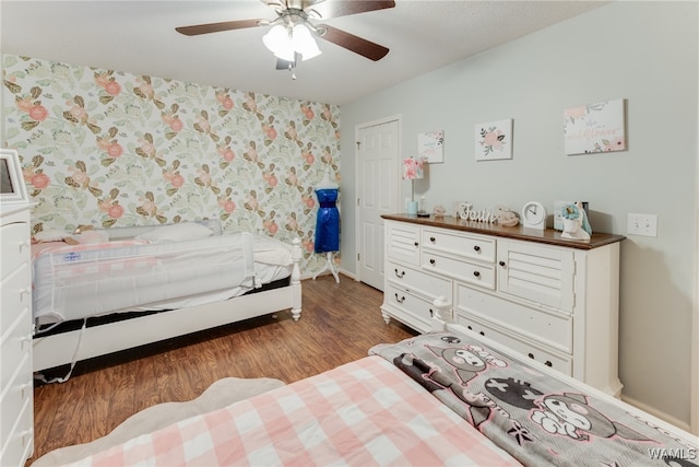 bedroom with hardwood / wood-style flooring and ceiling fan