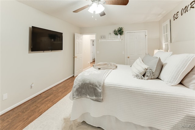 bedroom featuring hardwood / wood-style flooring and ceiling fan