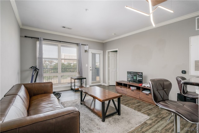 living room featuring hardwood / wood-style floors and ornamental molding