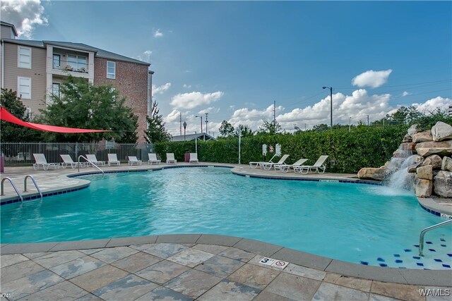 view of pool featuring a patio and pool water feature