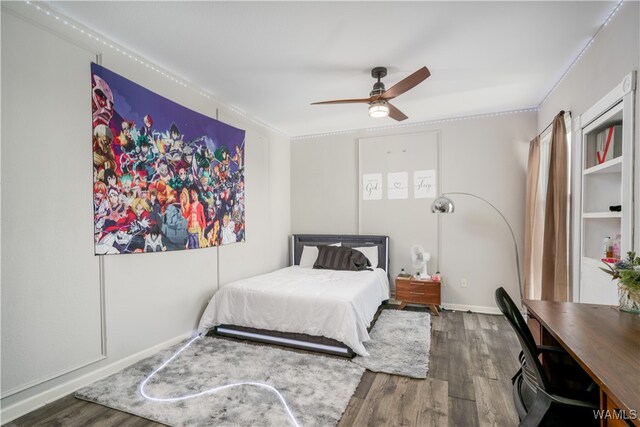 bedroom featuring ceiling fan and dark hardwood / wood-style floors