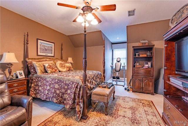 bedroom with light carpet, ceiling fan, and vaulted ceiling