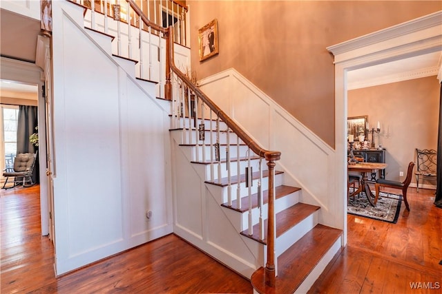 staircase with hardwood / wood-style floors