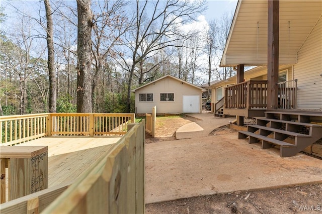 exterior space with an outbuilding and a deck