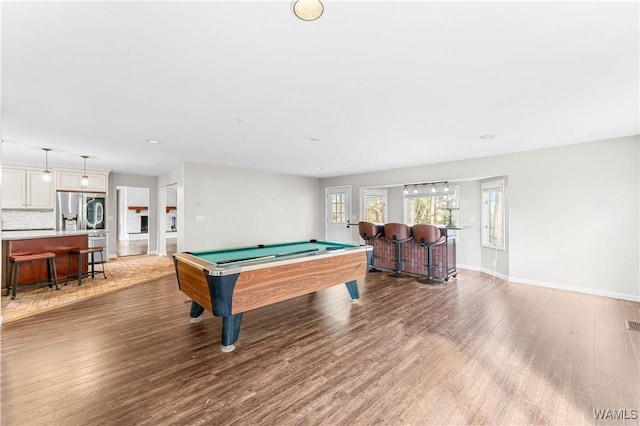 game room featuring baseboards, recessed lighting, wood finished floors, a bar, and billiards