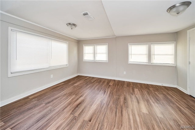 spare room with hardwood / wood-style flooring