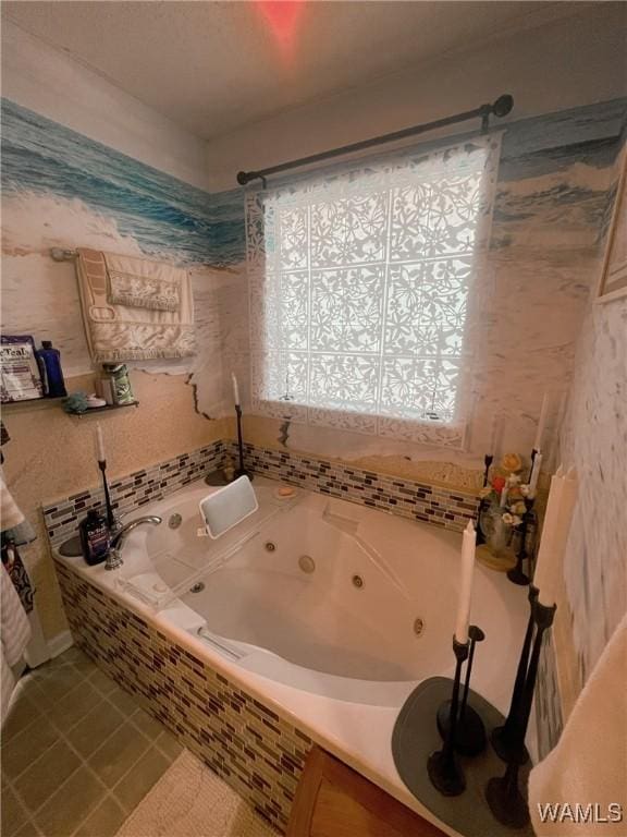 2712 Shady Bank Ln, Northport, AL 35473 - bathroom with a tub with jets and tile patterned floors