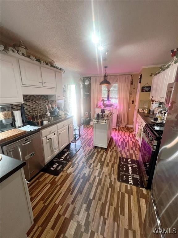 2712 Shady Bank Ln, Northport, AL 35473 - kitchen with a sink, white cabinets, appliances with stainless steel finishes, a textured ceiling, and dark wood finished floors
