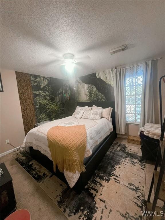2712 Shady Bank Ln, Northport, AL 35473 - bedroom with a textured ceiling, a ceiling fan, and baseboards