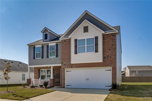 view of front of house featuring a front yard and a garage