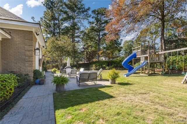 view of yard with an outdoor hangout area, a playground, and a patio