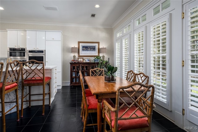 dining area featuring ornamental molding