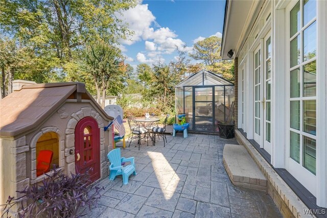 view of patio with a playground