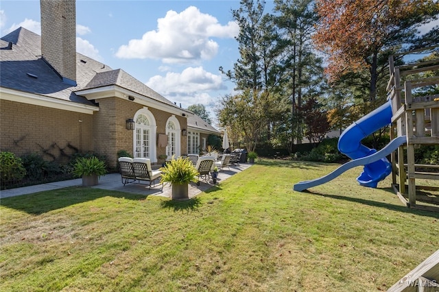 view of yard featuring an outdoor hangout area and a playground