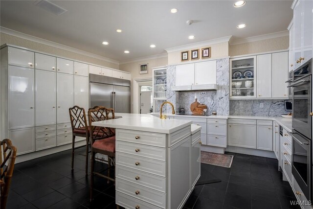 bar featuring white cabinetry, sink, and beverage cooler