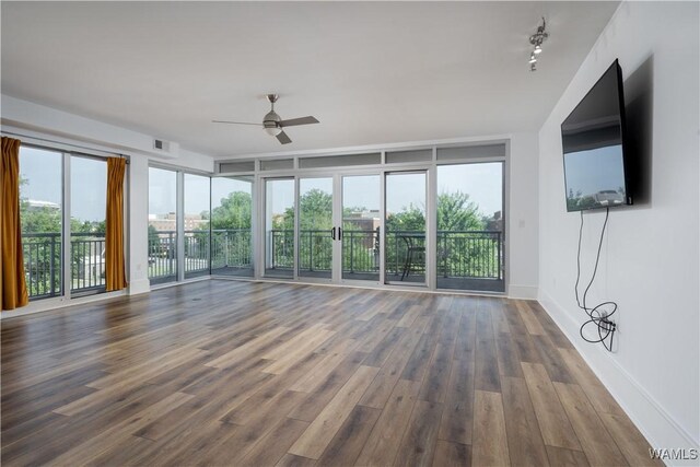1018 Hackberry Ln Unit 301, Tuscaloosa, AL 35401 - unfurnished living room featuring ceiling fan and wood finished floors
