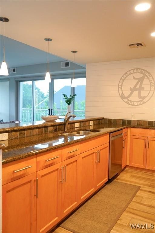 1018 Hackberry Ln Unit 113, Tuscaloosa, AL 35401 - kitchen with dishwasher, light wood finished floors, dark stone countertops, plenty of natural light, and recessed lighting