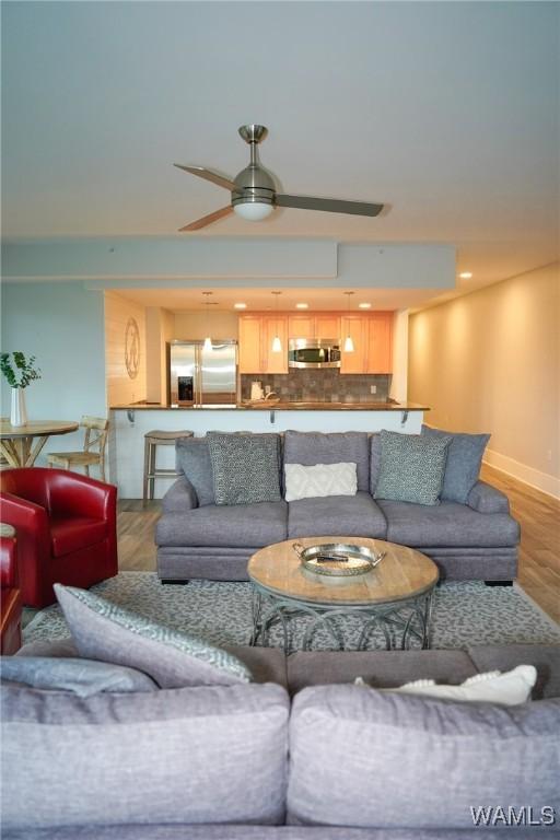 1018 Hackberry Ln Unit 113, Tuscaloosa, AL 35401 - living room featuring wood finished floors and ceiling fan